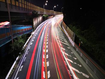 High angle view of light trails on road at night