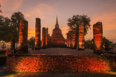 Entrance of temple against sky during sunset