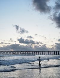 View of man fishing at beach