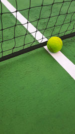 Tennis ball on court line tennis net 