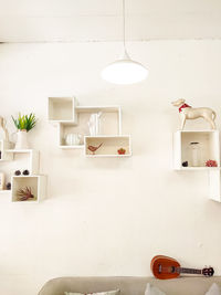 Empty chairs and table against wall at home
