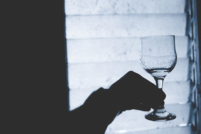 Close-up of hand holding glass of wine