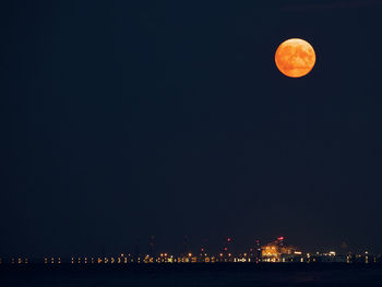 Full moon over port