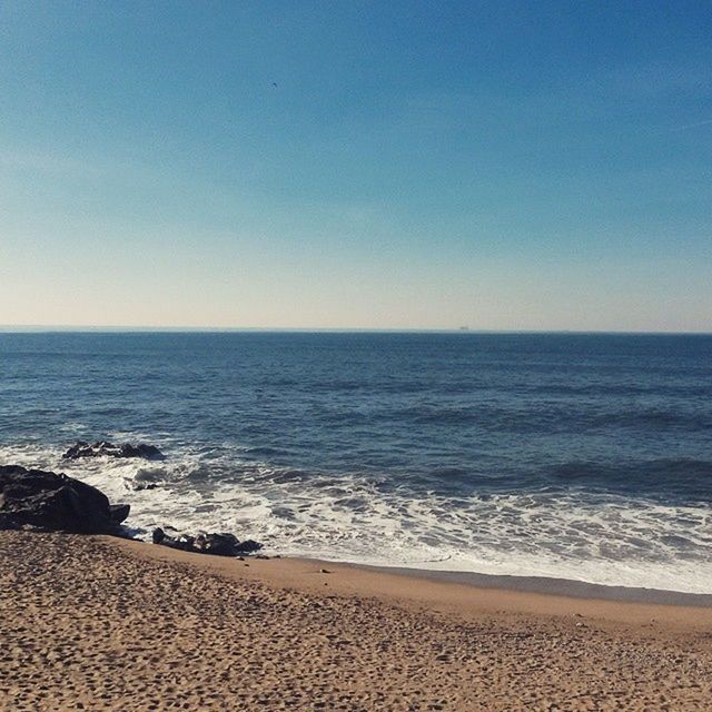 sea, beach, horizon over water, sand, shore, water, clear sky, tranquil scene, scenics, tranquility, copy space, beauty in nature, blue, nature, wave, coastline, idyllic, sky, vacations, surf