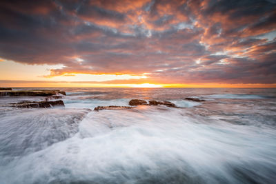 Scenic view of sea against sky during sunset