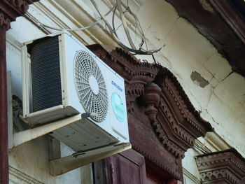 Low angle view of text on ceiling of building