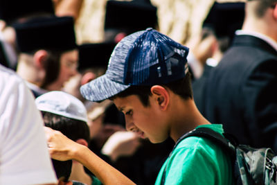 Portrait of boy looking at friends