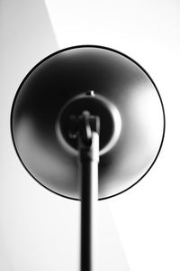 Low angle view of electric lamp against white background