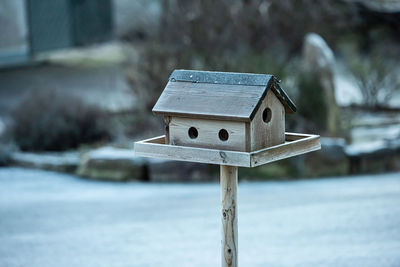 Wooden bird house on a cold, frosty day
