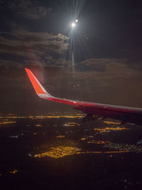 Airplane flying in sky at night