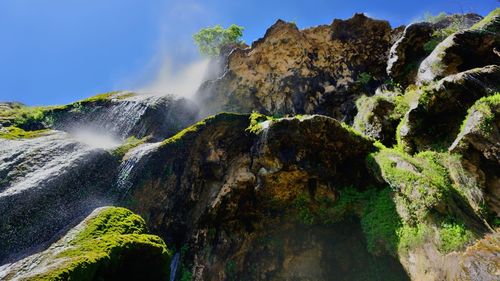 Scenic view of waterfall against clear sky