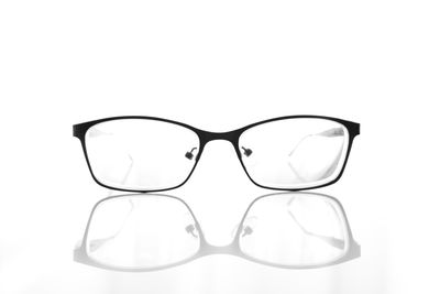 Close-up of eyeglasses against white background