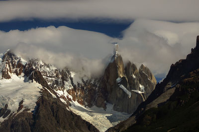 Panoramic view of snowcapped mountains against sky