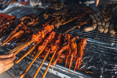 High angle view of meat on barbecue grill