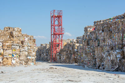 Abandoned construction site against clear blue sky