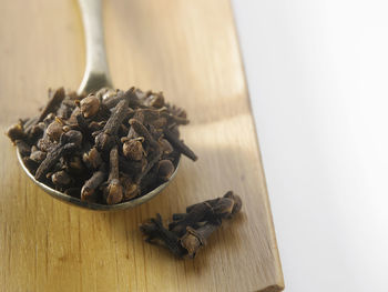 Close-up of cloves in spoon on k