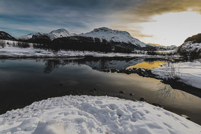 Scenic view of snowcapped mountains against sky during winter