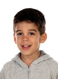 Portrait of happy boy against white background