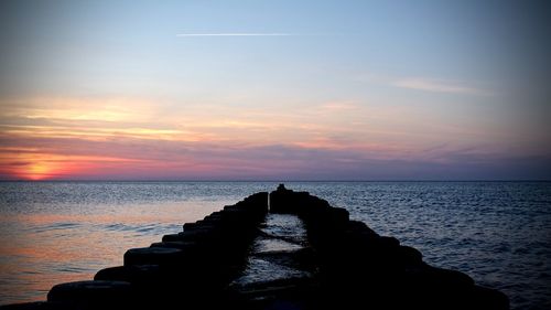 Scenic view of sea at sunset