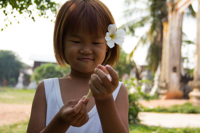 Portrait of a girl holding flower