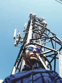 Low angle view of man against clear sky