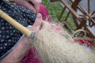 Midsection of woman holding straw