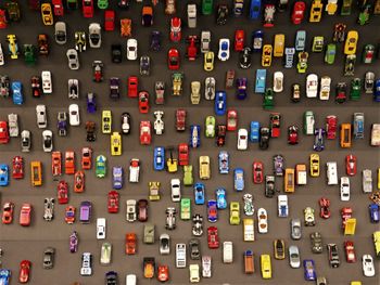 A lot of colorful matchbox cars in an exhibition in berlin.