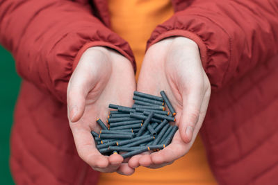 Close-up of man holding hands