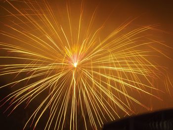 Low angle view of firework display at night