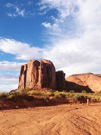 Rock formations on landscape against sky