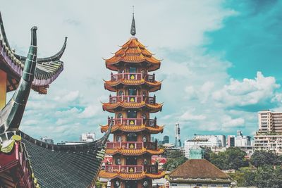 Panoramic view of buildings in city against sky