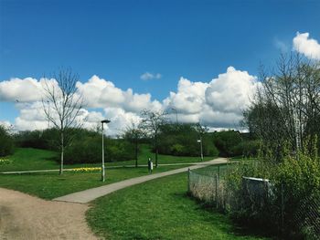 Scenic view of golf course against sky