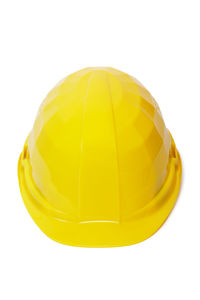 Close-up of yellow hat against white background