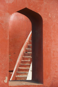 Staircase against brick wall