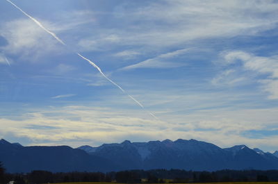 Low angle view of vapor trails in sky