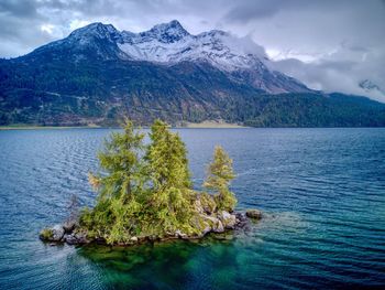 Scenic view of lake and mountains against sky
