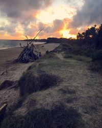 Scenic view of land against sky during sunset