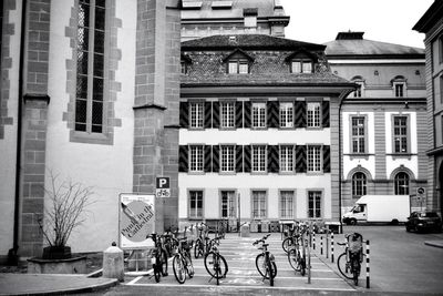 Bicycles on street against buildings in city