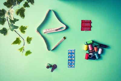 Directly above shot of sewing supplies on table