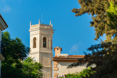 Beautiful exterior view of teulada church bell tower, in alicante, spain