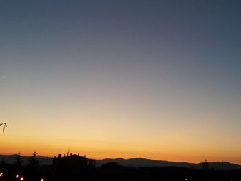 Scenic view of silhouette trees against sky during sunset