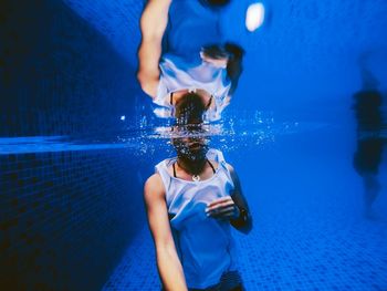 Woman swimming in pool