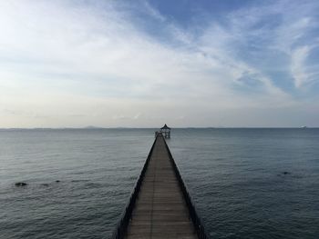 Pier over sea against sky