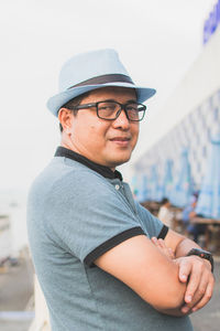 Side view portrait of man wearing hat