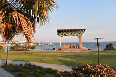 Built structure by sea against clear sky