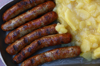 Close-up of fried sausages mashed potatoes
