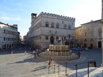 Group of people in front of historical building