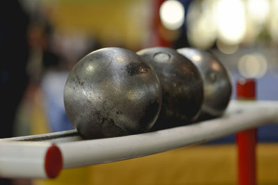 Close-up of balls on rack