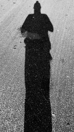 Shadow of people on road