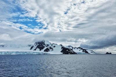 Scenic view of sea against sky during winter